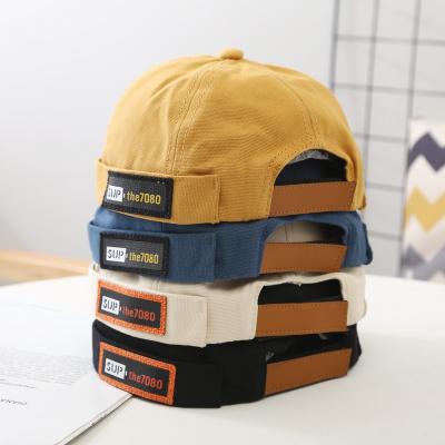 China Korean hot sale of new style boys and girls docker hat children's cotton canvas retro COMMON skull brimless hat for sale