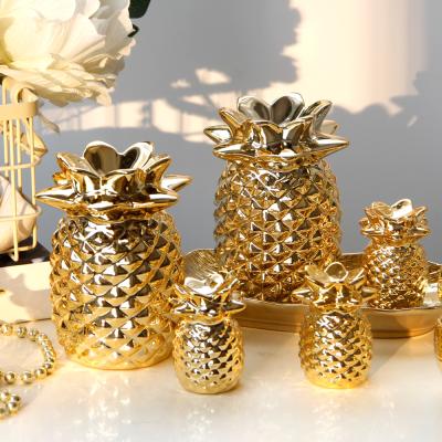 China Europe Amazon Hot Sale Desktop Ceramic Craft Porcelain Gold Pineapple Shape Art Craft For Home Decoration and Gifts for sale