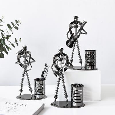 China Retro minimalist creative metal crafts pitch pen holder black character band office wholesale decoration for sale