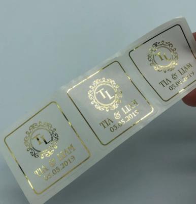 China Custom Transparent Hot Stamping Clear Adhesive Label Cosmetic Label Bottle Gold Foil Perfume Glass Bottle Sticker for sale