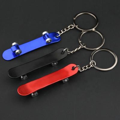 China Hot Sale Metal Scooter Key Chain Finger Beer Bottle Opener Skateboard Keychain Beer Bottle Opener Colorful Key Chain for sale