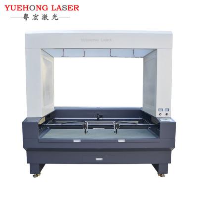 China Laser REDUCING embroidery badges textile fabric label YH1810 vision CCD laser cutting machine price for sale for sale