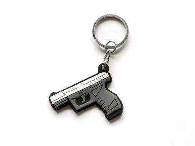 China Custom Logo Mini Key Chains Silicone Toy Gun Soft PVC Keychain zu verkaufen