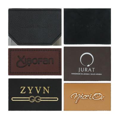 China PMS Faux Custom Leather Labels Clothing Handbag Tagger Vegan Merrow Border for sale