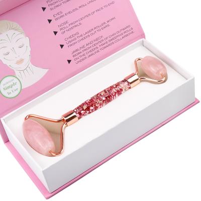 China Skin Tightening Cold Roller Mini Pink Quartz Private Label Tool Natural Facial Face Massage Stone for sale