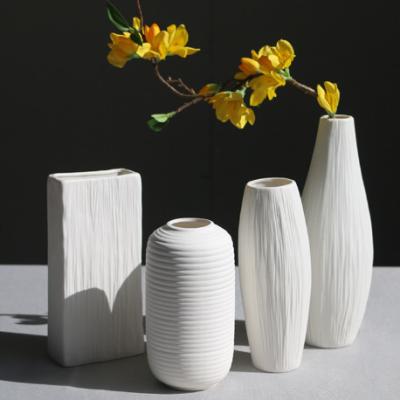 China Minimalist Antique Matt White Ceramic Irregular Art Decor Vase Plant Abstract Porcelain Indoor Vases Home Decorations for sale