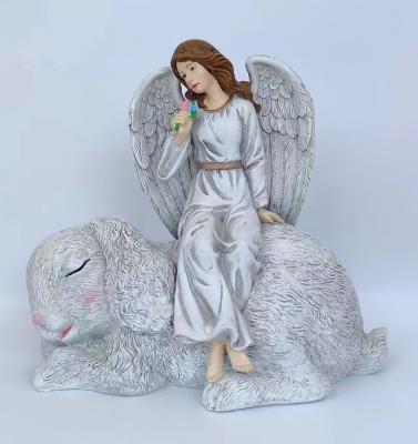 China Global Wholesale Modern Resin Sitting Angel Statue Angel Figurine With Cute Rabbit For Home Decoration Gifts for sale