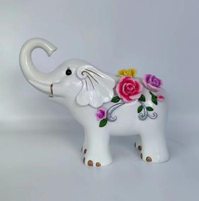 China World Modern White Ceramic Fake Resin Elephant Statue Flowers Outdoor Table Decoration Home Gifts for sale