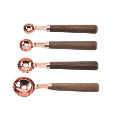 China Sustainable High Quality Food Grade 4 Size Rose Gold Stainless Steel Cake Baking Tool Sets With Wooden Handle for sale