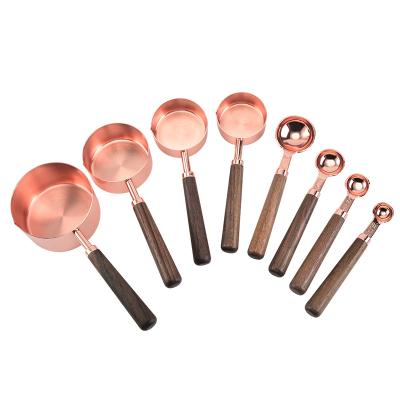 China 8pc Sustainable Professional Measurement Conversion Stainless Steel Measuring Cups And Spoons Set With Wooden Handle for sale