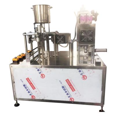 China Manual Beverage Gable Top Milk Filling Machine for sale