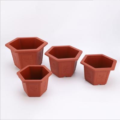 China Retro red CLASSIC balcony brick plastic hexagonal flower pot potted thickened flower pot for sale