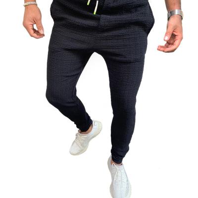 China Latest Breathable High Quality Jogger Fitness Sweatpants Gym Track Slim Fit Joggers Fashion Rope Street Wear Casual Men's Trousers Pants for sale