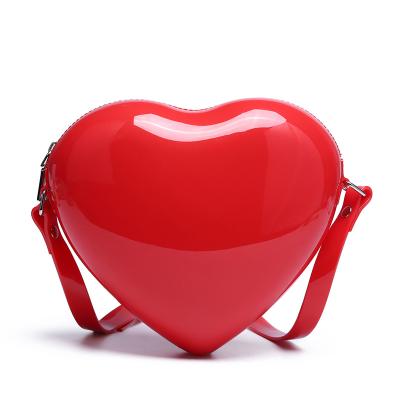 China Wholesale Fashion Cheap Fashion Large Charms Kids Girls Handbags PVC Pocket Heart Shaped Shoulder Bag for sale