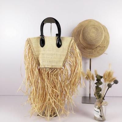 China Beautiful handmade fashion tassel rattan purse handbag for ladies and women for sale