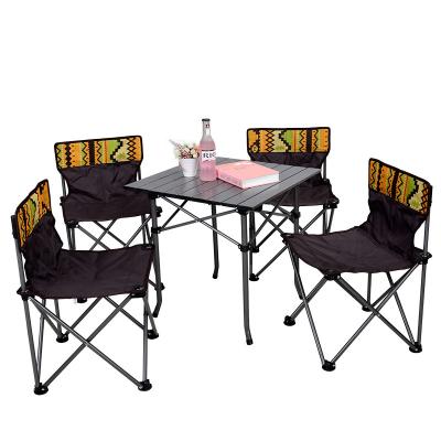 China Modern outdoor portable camouflage self-propelled barbecue table Clan style folding table and picnic five-piece chair combination for sale