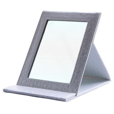 China Contemporary Home Decor Folding Leather Glass Cosmetic Mirror For Home for sale