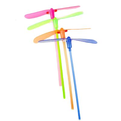 China Environmental friendly plastic outdoor play spinning pushing shiny bamboo flying saucer dragonfly boomerang kids toys for sale