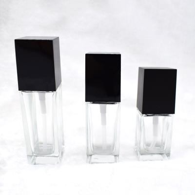 China Personal Care New Design Clear Square Glass Perfume Bottle With Lotion Pump for sale