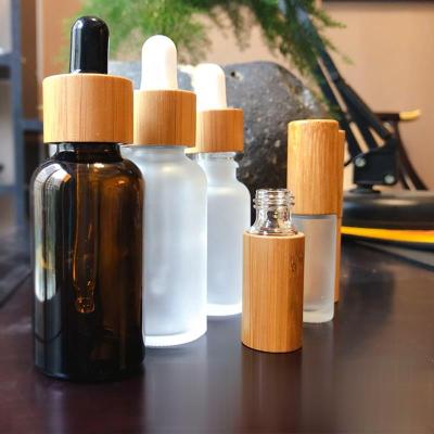 China New Design 30ml Amber 2oz Personal Care Frosted Glass Dropper Bottle With Bamboo Dropper for sale