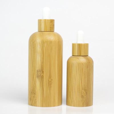 China Personal Care Customized 30ml 50ml Frosted Amber Bamboo Dropper Bottles With Cap for sale