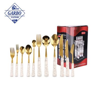 China Luxury Goldenware Sustainable Wedding Party Set Utensils 24pcs Sets Elegant White Ceramic Handle Stainless Steel Flatware Sets Service For 6 for sale