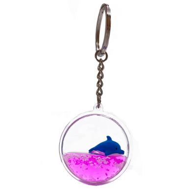 China Plastic Pink Liquid Key Chain With Cute Dolphin Floater Inside 3D Floater Key Chain for sale