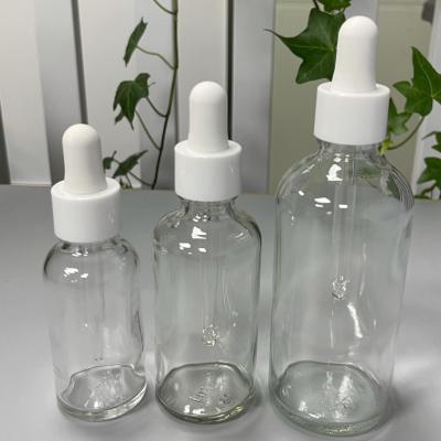 China Aromatherapy Cosmetic Glass Essential Oil Bottle Transparent Green Blue Brown Glass for sale