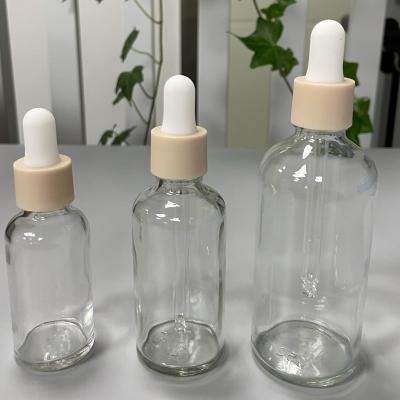 China Transparent Glass Bottle With Dropper for Skincare Serum PP Cap Pink for sale