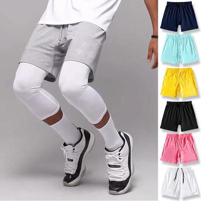 China Breathable American Summer Five Basketball Shorts Training Fitness Men But Loose Dry Knee Four Running Gear Sports Ball Pants for sale