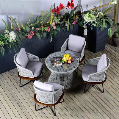 China Modern European Style Dining Sets Outdoor Rope Table And Chairs Outdoor Garden Furniture for sale