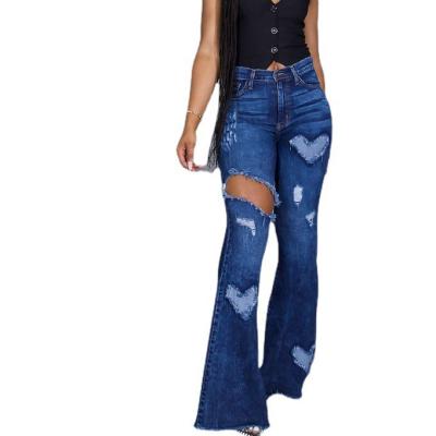 China 2021 Sustainable Women's Large Fashion Trend Personality Tight Holes Jeans Worn Bell Bottoms for sale