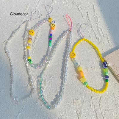 China New Handmade Korean CSI Gypsy Clay Yellow Smiling Face Soft String For Cell Phone Cocking String Beaded White Pearl Cell Phone String for sale