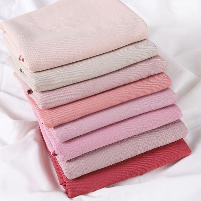 China Girle Hot Sale Dubai Solid Color Wrinkle Shawls Natural Women Ladies Scarves Fashion Ladies Viscous Polyester Hijab for sale