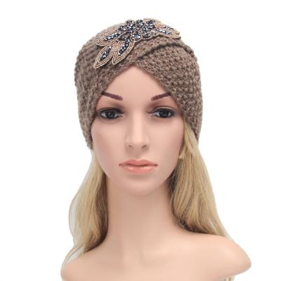 China COMMON Flower Bead Hat Cashmere Knit Indian Hat Criss Cross Hat Indian Red Knitted Beanie Hat For Women for sale