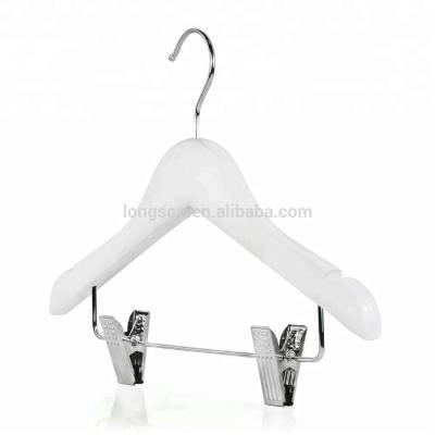 China Eco-Friendly Wholesale Kids Wooden Hanger With Metal Clips White Baby Wooden Hangers for sale