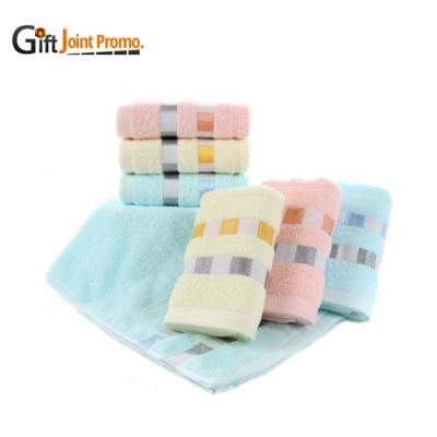 China Compressed Wholesale Printing Logo Elastic Cotton Bath Towel for sale