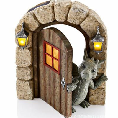 China JOWYAR Europe Garden Landscape Opening Door Figurines Decorums Mini Resin Garden Statue Dinosaur Climbing Window Sculpture for sale