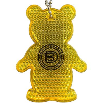 China Custom Bright Reflective Safety Printing Logo BEAR Shaped ABS HARD Plastic Key Chain Acrylic Reflective YELLOW Color Pendant for sale