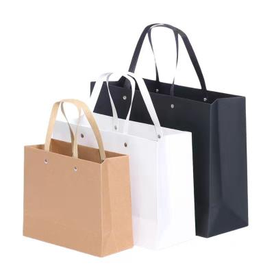 China Recycled Materials Wholesale Price Custom Shopping Bags With Logos Love&Roses Bag Rivet Paper Bag for sale