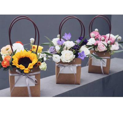 China Recycled Materials Flower Bag Packaging Portable Wedding Gifts Folding Paper Flower Box Bouquet Paper Bag for sale