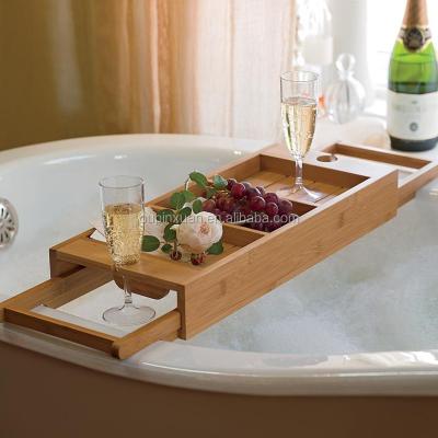 China 100% Sustainable Bamboo Bathtub Caddy With Extendable Sides Integrated Wine Glass Holder Design Bathroom Bathtub Caddy New for sale