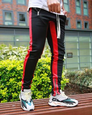 China new Anti-wrinkle fashion Europe men's sidestripe solid color pocket street pants outdoor sports fitness casual pants long pencil pants slim for sale