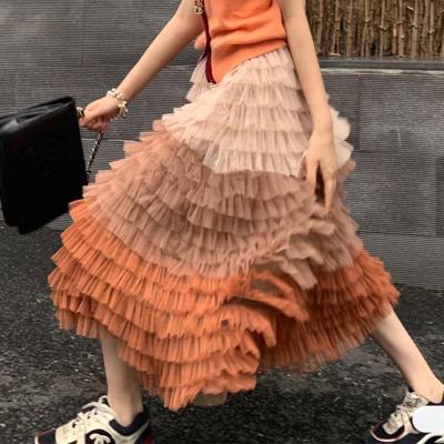 China Anti-static new 2022 spring and autumn long skirt women's gradient color printed cascading skirt flower ruffled casual long wome skirts for sale