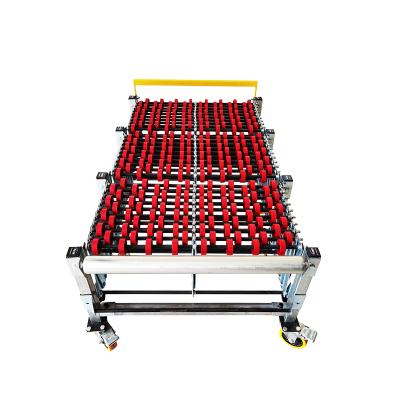 China High Quality Heat Resistant Carbon Steel Flexible Sliding Conveyor Gravity Drum Flexible Manual Conveyor for sale