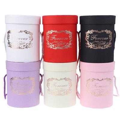 China Recycled Materials Round Cardboard Paper Tube Cylinder Packaging Portable Gift Box With Rope for sale