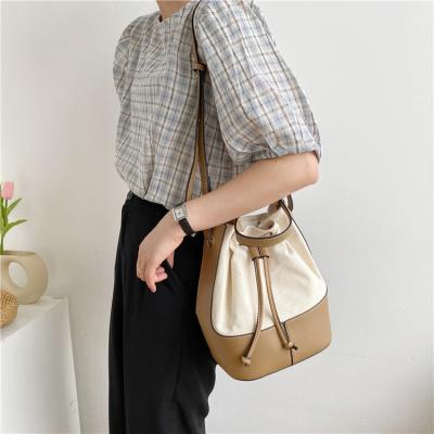 China Hot Selling High Quality High Quality Splicing Women Canvas Bag Vintage PU Bag And Canvas Bucket Cross - Body Bag With Two Straps for sale