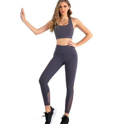 China Wholesale Breathable 2 Piece Workout Set Women Knitted High Quality Gym Clothes Sweat Set Ribbed Mesh Splicing Wicking Yoga Leggings for sale