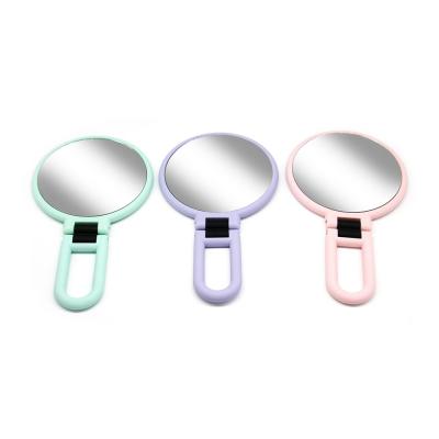 China Magnifying Portable Magnifying Make Up Mirror With Foldable Handle Double Side Comestic Mirror for sale