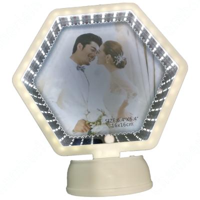 China Multifunctional Plastic Hexagon Shape Photo Frame Heat Transfer Lighted Magic Mirror for sale